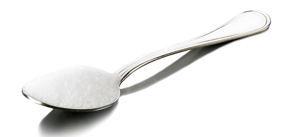 The benefits of Pure MSM (Organic Sulfur) | A spoon holding pure MSM crystals